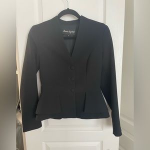 Black suits in great condition size 30 for both jacket and skirt.